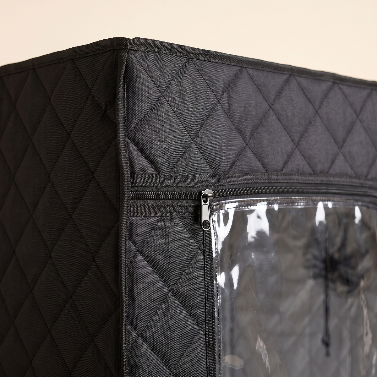 Close up of quilted black sauna fabric and zippered clear window