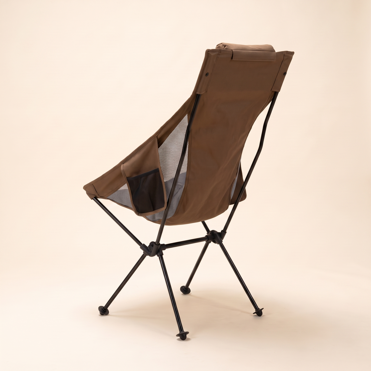 Ultralight high back camping chair in brown on a cream studio background